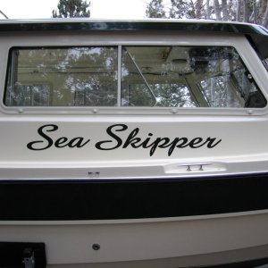 (Sea Skipper) Carabineers are attached to pre adjusted fender whips and are in turn clipped to eye loops above rub rail - one showing below name.