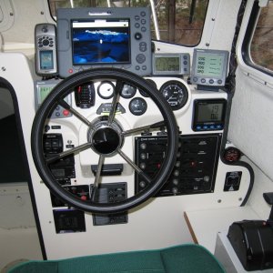 (Sea Skipper) Raymarine E80 Display with redundant handheld GPS to port & 2nd fluxgate compass to starboard.  Ray ST60 Graphic far right frees up space on main display normally devoted to data.