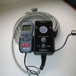 (Sea Skipper) Remote control for main engine throttle, shift and windlass on 25? cable.  Wireless autopilot and data display attached to side.  Lanyard to right side of control is attached to a magnetic kill switch.  The other end should be attached to me!