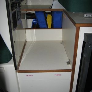 Foot rest raised 2-1/2" - Skipper's primary life jacket stored in side pocket.