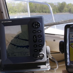 Moving from the Tennessee River to the adjoining Flint River dead ahead. The GPS route to the FLINT RIVER waypoint is shown on the GPS by a red trace. The Furuno 1715 Radar is interfaced to the Garmin GPS via communication ports. The radar displays a lollipop with the circle showing the entrance corresponding to the GPS waypoint. See the close ups of the GPS and Radar screen for better detail.