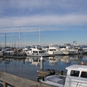 Just boats with a partially clear sky.