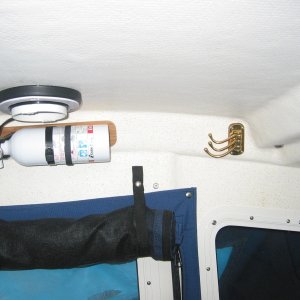 Brass coat hanger.  a nice addition that folds out of the way when not needed.