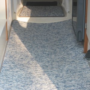 Removable marine grade berber carpet. Very easy to clean. Very durable. Keeps boat a lot cleaner, warmer, and quieter.