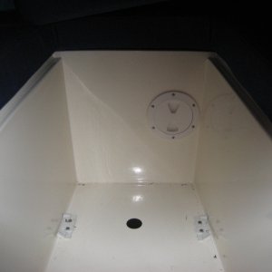 Access hole and cover used to run pump-out and vent hoses through.