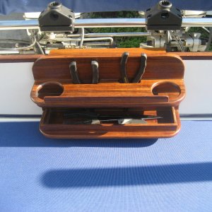 Teak,epoxy saturated,polyurethane finished, fishing tool and beverage holder.