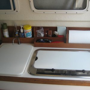 Additional galley storage racks and PVC sink and stove covers.
