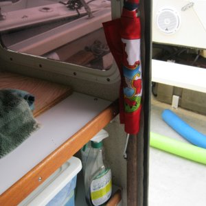 Picture is really of the furled flag and mast, clipped to bulkhead with Beckson clips. Wonderful things those clips.