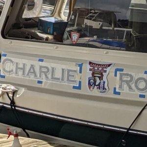 Charlie Rock gets her name.  it's all in the prep!  I had never used the "wet install" method for boat or truck decals.   What a breeze.  Not a single bubble, even where they had been shipped, or stored with wrinkles.  The bigger the squeegee the better.  And painters tape for location marking.  2 hours of prep ( port and starboard name rapes, 187th aarct decals on both side and cabin door, port of call on stern, and registration on both sides of bow).  An hour to dry, and 45 mins of tape and backing removal.