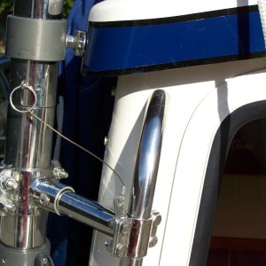 Additional support clamped to grab handle. Pin allows arm to be locked in set position when needed. With pin removed arm rotates as neccessary when loading/unloading dinghy.