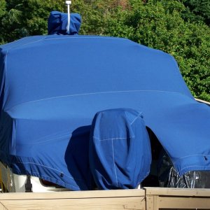 Great fit. No puddling of rain/snow. Wind can not get under cover. Outboard motor cover is seperate piece.