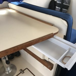 Installed drawer under table.