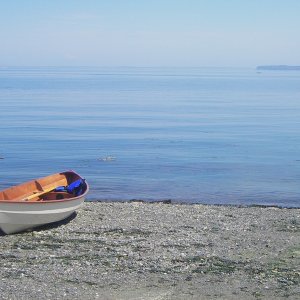 Home built, stich & glue, nice boat, grumpy owner.  At Port Williams, just out of Sequim Bay, with Protection Island just across the glass.