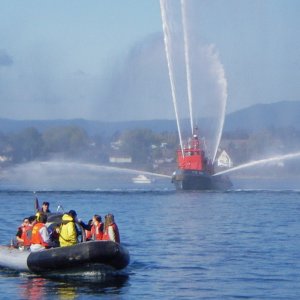 Free rides in the fastboats, but not fast enough to dodge the fire boat spray.  Victoria Navy days.