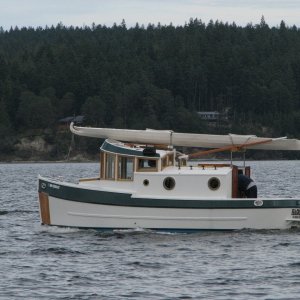 A Home built, and really cute, tug at Sequim Bay State Park, with a kayak wrapped on top.