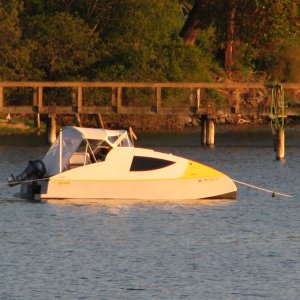 I saw this boat in a wooden boat magazine, very efficient, low HP OB, pretty extensive range, moderate accommodations for size.