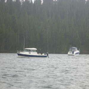 Phil Parsons one of the fishing guides for hire at Jackson lake coming in after getting drenched in an afternoon thunder storm. He is a great guy who offered us everything from watching TV on his boat to lending me a complete dipsy diver fishing rod setup.