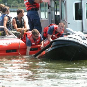 USCG Station Little Creek responds. Within minutes of this pix, CG receives emergency call- transferring the 4 teens to Sea Angel before Va. Beach Fireboat #1 arrives.