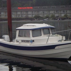 "Enforcement" came in with the Indian canoes.  It's a support boat traveling with the "Tribal Journey -07"