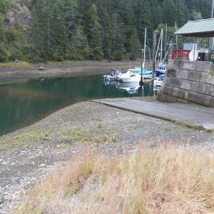 The public ramp, like many, it isn't made for low tide use.  It dropped off about a foot right at the edge.  On the other hand, I didn't see any launch fee.