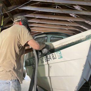 Gelcoat spider crack removal. What a nightmare to repair, or so I thought until I consulted with Andy of Boatworks Today. He convinced me to just abandon the gelcoat and completely sand it off wherever there was spider cracking, put new fiberglass over those areas, and then paint the boat with a high quality marine exterior paint like Alexseal. So the sanding begins...