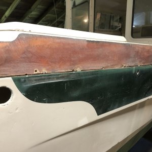 Because the section of the boat above the rubrail had many areas of spider cracking, I just removed all the gelcoat from that part of the boat. In some spots the spider cracking continued into the fiberglass so I removed that as well, and then put new fiberglass over the entire area. I used polyester laminating resin to do all gelcoat repair, which required painting with gelcoat so it would cure. Then sanding off the gelcoat so a final layer of Totalboat epoxy fairing can be applied and sanded down smooth in prepartion for the Alexseal primer coat.