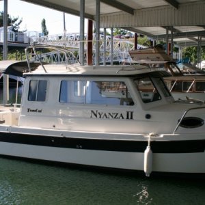 Finally put our name on - "Nyanza II" - also shows our new slip.
