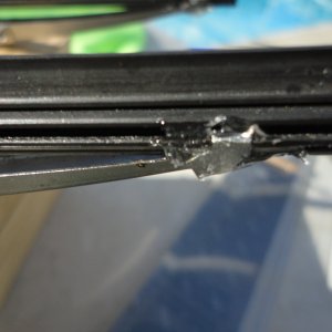 Small amount of "GooP" on one end clip to secure the rubber in the wiper brackets.