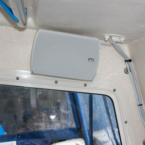 Poly Planar MA 7500 speakers.  They sound great!  Brackets thru bolted to take the usual pounding we get a some point during a long weekend cruise.  Port side.