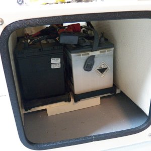 A little shelf made out of Azek allows them to sit side-by-side under the seat box.