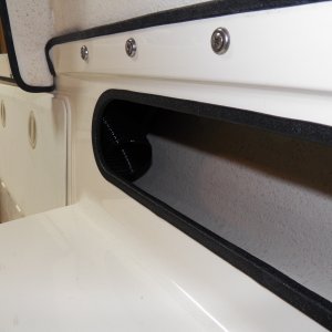 The heater control isn't a thermostat.  The thermostat is actually in the return airflow to the furnace.  Inside of the new pocket shelf is the "cold air return" that will determine the heat setting.  The little controller is supposed to allow settings between about 45 degrees and 90 degrees, but you don't get to see actual temperature numbers.