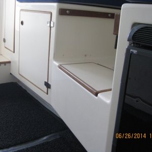 Storage under and behind dinette