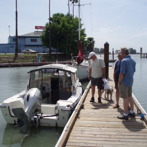 Steve Grover (Tee Ten) and Sidney (dog), Joel and Steve (SeaSpray) checking out Tee Ten.