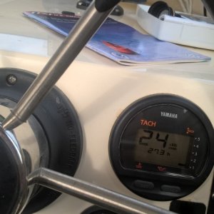 2400 rpm gives a SOG of 6.2 knots at .7 gallons per hour (supposedly 10 mpg, although I usually only get 8).  At WOT I have seen it go as high as 3.6 gph. 
 Yes, I'm only in 5.3 feet of water, but I'm heading out of the little bay right in front of my cabin.  It's cool.