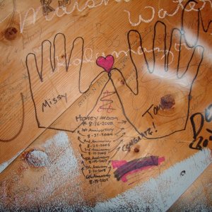 This is on the inside of a lookout tower/giftshop in Michigan's UP. You are allowed to write all over the walls on the inside unless it's naughty.