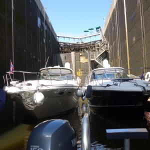 Carillion,  rare lock with floating dock and boats rafted together, massive 200 ton guillotine lower door