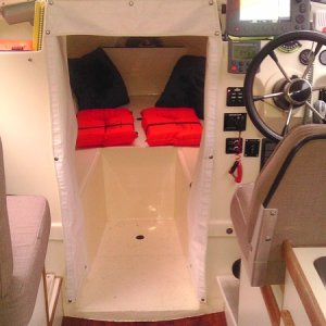 Tan Cuddy Cushions stored in home during winter. Synthetic wood flooring for wet environments provides extra insulation, eliminating the wet carpet issues.