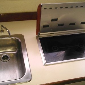 Wallas stove and stainless sink - Lid up for cooking, lid down and fan converts oook top to cabin heater. Very efficient heating and cooking unit.