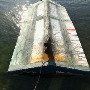 Cuban refugees came over in this overturned homemade: not a C Dory! We found this floating offshore near Plantation Key; 3 bladed prop has 2 blades for smooth ride.