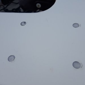 Epoxy filled holes. Notice the air bubble... Fixable though.