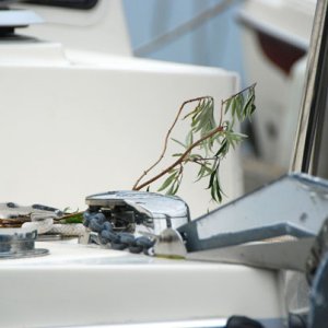 Greenery on the bow to ensure safe returns