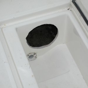 Again, not for the faint of heart! 8"
hole at rear of fish box. Yes, the fish box walls are cored with balsa. The piece that came out was separated due to water intrusion.