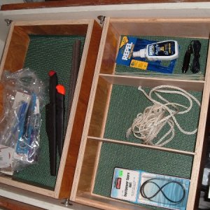 Adding storage for small items under forward dinette seat