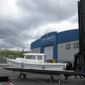 2017-04-18 Setting boat onto work stand to remove the straps, then it will be lifted onto storage rack inside the building