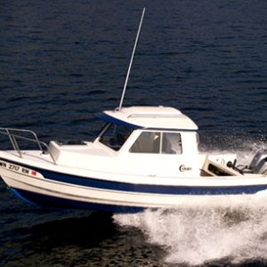 First boat, 2001 CD-16, Used in C-Dory Brochure Photo.  The factory borrowed our boat for their photo shoot. Three subsequent factory owners used the pictures as well.