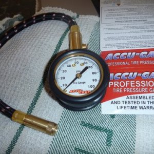 Rubberized removable protective guard has push button as the gauge will hold pressure. Button releases it or hold button to release air and the gauge will read what it is dropping down to. Sells for about 21.00 dollars. Works great. I have no interest in the company,assembled in the U.S.A.
http://www.getagauge.com/