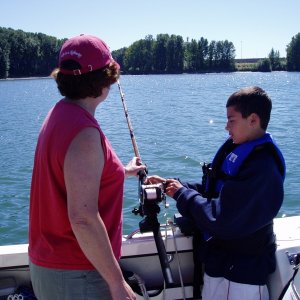 Grandson learning the touch for sturgeon nibbles