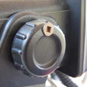 Like most radios, mine just has twist knobs to hold it to the bracket.  I used the right length screw to drill a hole through the knob and into the bracket (and not into the radio).  The bracket can't be removed with the radio in place.  A thief would need to figure out the problem and have a short-shaft #2 square drive screwdriver.