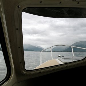 View of Mendenhall Bar entrance with boat pulling crab pots at green marker 19A.