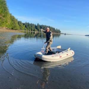 Maiden voyage with our new used dink! Low tide, about 3" of water